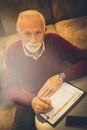 Business senior man signing at document Royalty Free Stock Photo