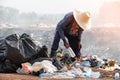 Editable of poor people scavenging recyclable trash