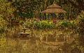 Artistic Water Fountain and Gazebo in the Garden Royalty Free Stock Photo