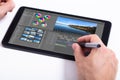 Editor editing video on tablet Royalty Free Stock Photo