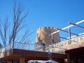 Clearing snow from an unusual building Royalty Free Stock Photo