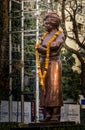 EDITORIAL. dated : 14 feb`2021 location : Dehradun, INDIA. A bronze statue of Swami Vivekananda with garland around the neck to