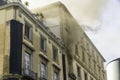 Editorial, Domestic apartment fire with smoke billowing from upstairs window. Garibaldi Square, Naples, Italy