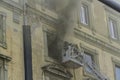 Editorial, Domestic apartment fire with smoke billowing from window. Garibaldi Square, Naples, Italy. Fire engine basket or cage