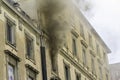 Editorial, Domestic apartment fire with smoke billowing from window. Garibaldi Square, Naples, Italy