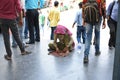 Editorial: Gurgaon, Delhi, India: 07th June 2015: An unidentified old poor woman begging from people at Gurgaon Metro Station