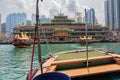 Navigating through Aberdeen harbor with a sampan