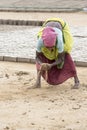 Editorial illustrative image. Poor worker woman in India