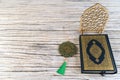 Mushaf Medina Holy Quran With Decorative Islamic Pendant and geometric ornament on wooden wooden table Royalty Free Stock Photo