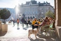 Editorial image, Serbia Novi Sad December 2020. People having a rest sitting in a cafe on the central square on a sunny day Royalty Free Stock Photo