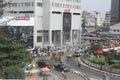 Editorial image of a street scene in marina, Lagos Nigeria, showing people and buses
