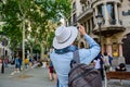 Editorial. May, 2018. Barselona, Spain. A young man, tourist takes photos by smartphone in front of a historic building in the ce