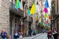 Editorial. May, 2018. Tourists on street of Girona. Street Girona, decorated with colorful shawls. Royalty Free Stock Photo