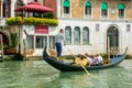 Editorial. May 2019. Venice, Italy. Gondolier driving the gondola with tourists Royalty Free Stock Photo