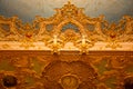 Richly decorated ceiling fragment with a clock in the auditorium of the La Fenice Theatre Royalty Free Stock Photo