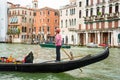 Editorial. May 2019. Venice, Italy. View of the city Grand Canal in Venice. Gondolier driving the gondola Royalty Free Stock Photo