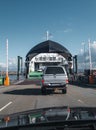 Cars driving on the ferry at Mortavika that is transporting them to ArsvÃÂ¥gen, Norway Royalty Free Stock Photo