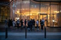 People queuing at popular retail store.