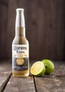 Editorial photo of bottle of Corona Extra Beer with lime on dark wooden background Royalty Free Stock Photo