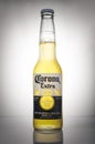 Editorial photo of Corona Extra beer on white gradient background