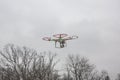 Editorial photo of a DJI Phantom drone in flight with a mounted GoPro Hero3 Black Edition