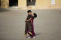 Editorial Photo happy boy and girl playing in the courtyard of Amber Fort in Jaipur