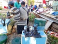 Editorial photo, indonesia, 20 august 2022, east jakarta man rewinding celluloid film, analog movie, prepare for layar tancap