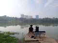 Editorial Photo, Indonesia, East Jakarta, Cibubur, 08 August 2021, Man Fishing at Lake