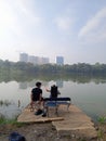 Editorial Photo, Indonesia, East Jakarta, Cibubur, 08 August 2021, Man Fishing at Lake