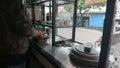 Editorial photo, indonesia, east jakarta, 11 october 2022, man preparing soto to take away by customer, tomato, chicken, potato, m