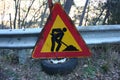 Editorial photo of a road construction site. warning signs of work in progress. cartels written in Italian. public message