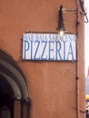 Editorial pizzeria restaurant sign on old building in Vernazza Cinque Terre Italy Royalty Free Stock Photo