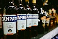 Editorial selective focus photo of Campari bottles - an italian alcoholic liqueur