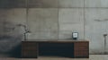 Editorial Style Photograph Of Bureau In Simple Brutalist Environment