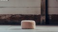 Editorial Style Photograph Of Pouf In Simple Brutalist Environment