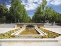 Editorial tourists walk by the fountain entrance to Retiro Park