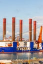 Editorial, wind turbine installation vessel WTIV specifically designed for the installation of offshore wind turbines, telephoto Royalty Free Stock Photo