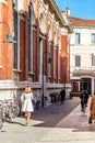 Editorial, woman walking in street