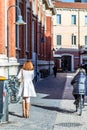 Editorial, woman walking in street