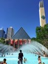 A group of young children and parents enjoying an outdoor wading pool