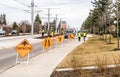 LRT construction landscaping public work with a line of warning road signs