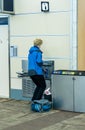 A traveler is filling an empty water container after security check