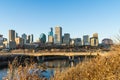 Edmonton, Canada, November 10, 2023: View to downtown in fall season in low sun light with deep shadows and bright wam highlights