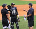 Eduardo De Oleo and Alvaro Noriega get coaching from Manager Luis Dorante.