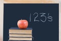 Education: 123's on chalkboard, books, apple Royalty Free Stock Photo