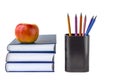 Education or back to school concept. An apple on a stack of books and black stationery glass Royalty Free Stock Photo