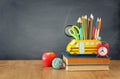 Education and back to school concept. pencils stand as bus over wooden desk infront of classroom blackboard Royalty Free Stock Photo