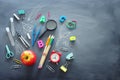 Education and back to school concept. shapes cut from paper and painted of backpack, books, chemistry flask and apple over Royalty Free Stock Photo