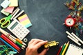 Education and back to school concept. stationery and bus over classroom blackboard. top view, flat lay Royalty Free Stock Photo