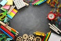 Education and back to school concept. stationery and bus over classroom blackboard. top view, flat lay Royalty Free Stock Photo